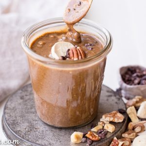 This Banana Nut Butter with Cacao Nibs is a sweet spreadable treat made with pecans and walnuts, and crunchy cacao nibs in every bite! This sugar-free nut butter is paleo, vegan, and Whole30-friendly - you'll want to spread it on everything.