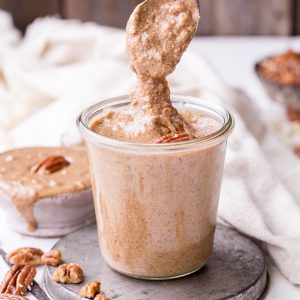 This Butter Pecan Nut Butter is smooth and creamy, with crunchy pecan bits stirred in and all the butter pecan flavor you love! This simple-to-make spread is perfect on oatmeal, fruit, toast, or just eaten with a spoon. It's gluten free, sugar free, paleo, and Whole30-approved.