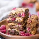 These Raspberry Blondies are incredibly soft and chewy and full of bright berry flavor. These gluten-free, Paleo and vegan blondies are made with cashew butter, coconut flour, and fresh raspberries!
