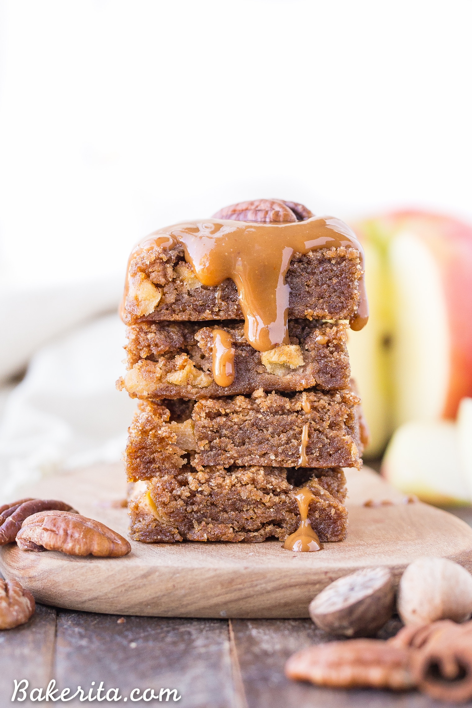 These Apple Blondies are full of warm spices and topped with an absolutely scrumptious (and SUPER easy) caramel glaze. These chewy, soft apple blondies are gluten-free, paleo and vegan.