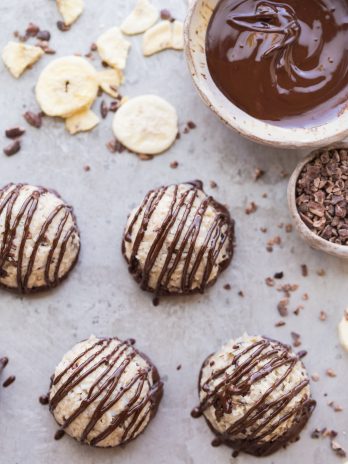 These No-Bake Chocolate Dipped Banana Macaroons are a quick and easy treat bursting with banana flavor! These gluten-free, paleo, vegan, and nut-free macaroons are hard to resist, especially once they're dipped and drizzled with dark chocolate.