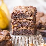 These Chocolate Chunk Banana Nut Blondies are a super chewy blondie, flavored with fresh bananas and studded with crunchy walnuts and dark chocolate chunks. You'd never guess that they're gluten-free, paleo and vegan.