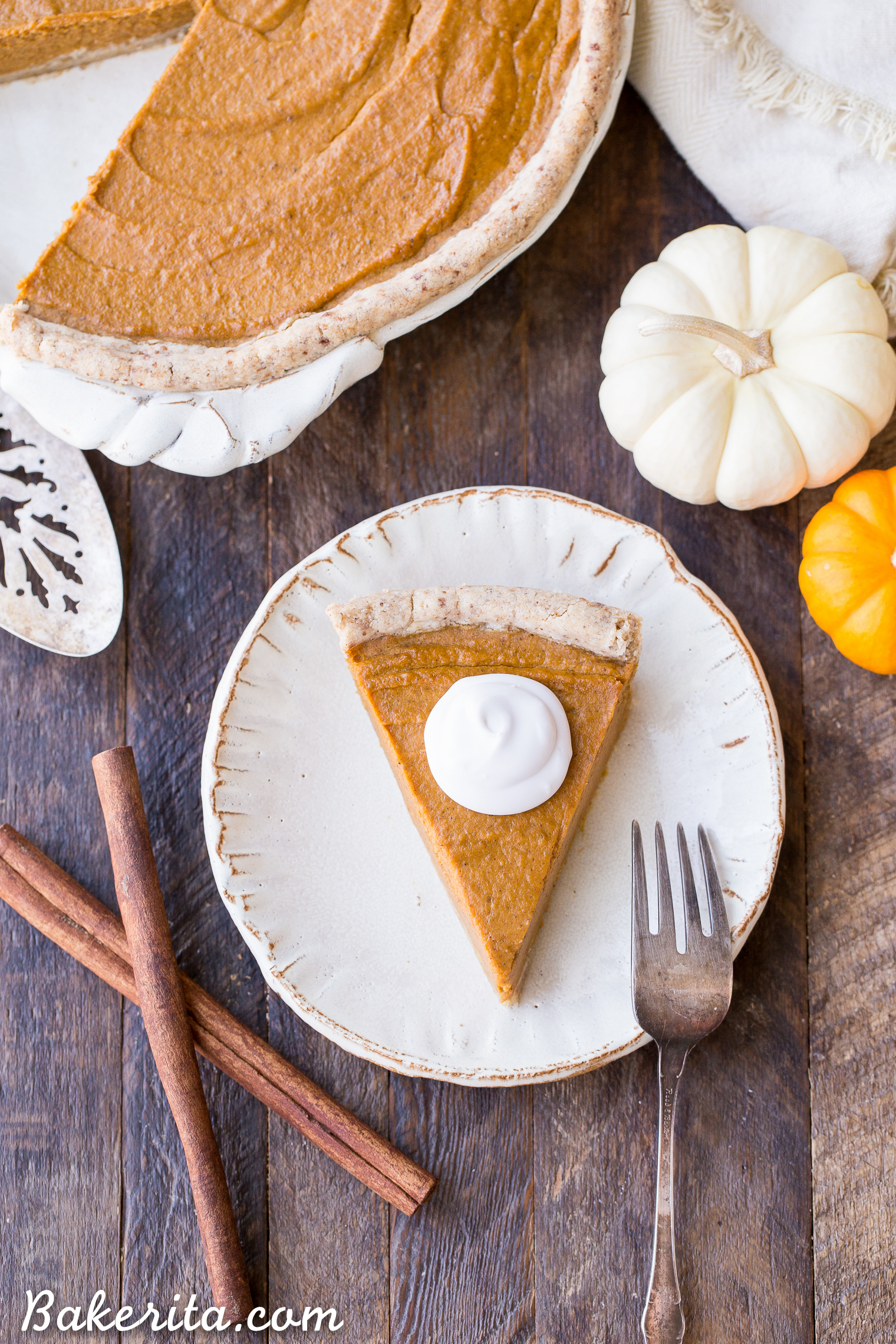 This Paleo + Vegan Pumpkin Pie is smooth, creamy, and perfectly spiced, with a flaky crust that you'd never believe is gluten-free, paleo AND vegan. This is allergy-friendly pie will be a holiday dessert staple.