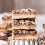 These Pecan Pie Bars are thick and caramelly, with a crispy coconut flour shortbread crust and a gooey pecan pie filling on top. These gluten-free, paleo, and vegan bars will be the star of your dessert spread!