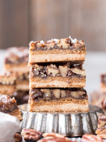 These Pecan Pie Bars are thick and caramelly, with a crispy coconut flour shortbread crust and a gooey pecan pie filling on top. These gluten-free, paleo, and vegan bars will be the star of your dessert spread!
