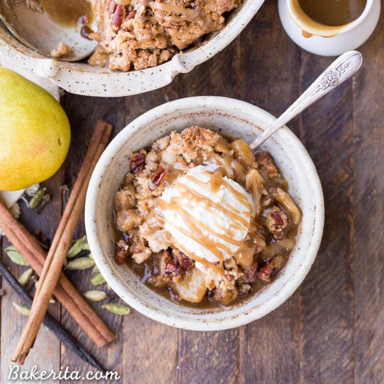 This Caramel Pear Crisp is a decadent and deliciously spiced dessert that's perfect for the holidays. The caramel pear filling is spiced with cinnamon, cardamom, cloves, and vanilla bean, and topped with a crunchy almond flour and pecan crisp topping. Don't forget to serve this gluten-free, paleo, and vegan crisp with some whipped coconut cream!