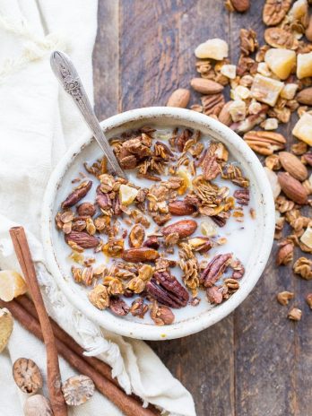 This Gingerbread Granola is crunchy & full of clusters, with loads of warm gingerbread spices, molasses, and bits of chewy crystallized ginger. This gluten-free and vegan breakfast is perfect for breakfast, or to package up in a cute jar and gift as a gift!