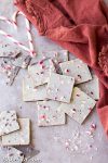 This Chocolate Peppermint Bark is a healthier twist on the holiday classic! It has a layer of dark chocolate topped with minty homemade vegan white chocolate and a sprinkling of crushed peppermint candies. You'll adore this gluten-free, paleo and vegan peppermint bark!