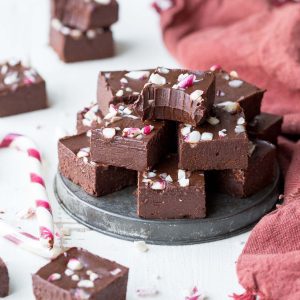 This Easy Chocolate Peppermint Fudge is the perfect, super simple holiday dessert. It's made in just five minutes with only five ingredients, and it's gluten-free, paleo, dairy-free, and vegan. This rich, super chocolatey fudge will melt in your mouth!