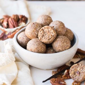 These Pecan Pie Fat Bombs are a super filling nutritional powerhouse, with loads of healthy fats and protein, and no sugar needed! These fat bombs full of vanilla bean and buttery pecans, and they're gluten-free, paleo, vegan, keto, and Whole30-approved.