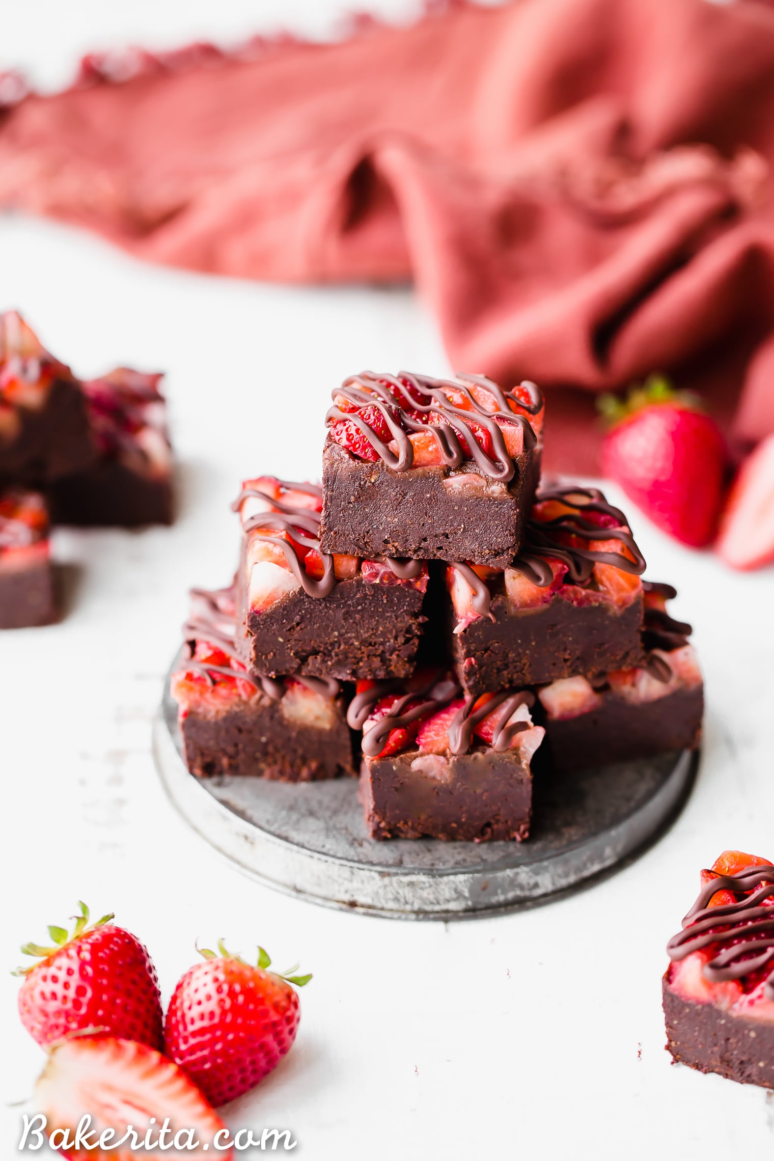 This Chocolate Strawberry Fudge is a simple and delicious five-ingredient recipe you'll want to make over and over! This fudge tastes just like chocolate covered strawberries. There's no cooking required for this gluten-free, paleo and vegan fudge recipe. 