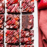 This Chocolate Strawberry Fudge is a simple and delicious five-ingredient recipe you'll want to make over and over! This fudge tastes just like chocolate covered strawberries. There's no cooking required for this gluten-free, paleo and vegan fudge recipe. 
