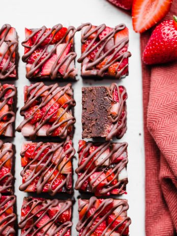 This Chocolate Strawberry Fudge is a simple and delicious five-ingredient recipe you'll want to make over and over! This fudge tastes just like chocolate covered strawberries. There's no cooking required for this gluten-free, paleo and vegan fudge recipe. 