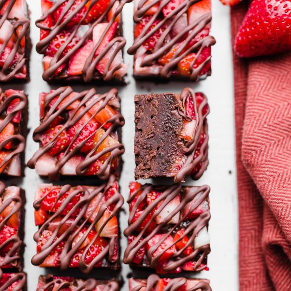 This Chocolate Strawberry Fudge is a simple and delicious five-ingredient recipe you'll want to make over and over! This fudge tastes just like chocolate covered strawberries. There's no cooking required for this gluten-free, paleo and vegan fudge recipe. 
