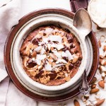 This Almond Joy Oatmeal is a creamy chocolate oatmeal that's sweetened with just a ripe banana and topped with coconut, almonds, and more chocolate! This hearty breakfast is decadent, filling, and you can enjoy it guilt free - unlike its candy bar equivalent!