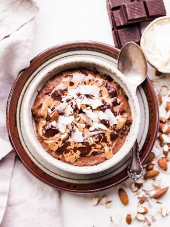 This Almond Joy Oatmeal is a creamy chocolate oatmeal that's sweetened with just a ripe banana and topped with coconut, almonds, and more chocolate! This hearty breakfast is decadent, filling, and you can enjoy it guilt free - unlike its candy bar equivalent!