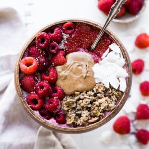 This Raspberry Almond Butter Smoothie Bowl is a creamy, sweet breakfast treat that can be made in just a few minutes and is begging to be loaded up with all of your favorite toppings! You'd never guess there was a hidden veggie in there, too.