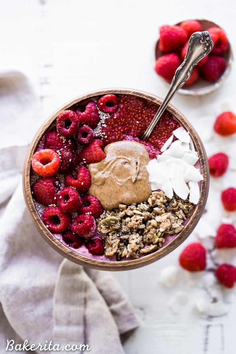 This Raspberry Almond Butter Smoothie Bowl is a creamy, sweet breakfast treat that can be made in just a few minutes and is begging to be loaded up with all of your favorite toppings! You'd never guess there was a hidden veggie in there, too.