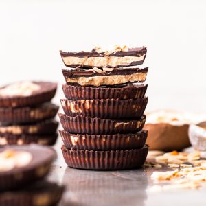 These Toasted Coconut Butter Cups are made with just four simple ingredients! Toasted coconut butter is the star of the show, encased in decadent homemade chocolate for a healthy homemade candy that will satisfy your sweet tooth. You're going to love these paleo + vegan coconut butter cups.