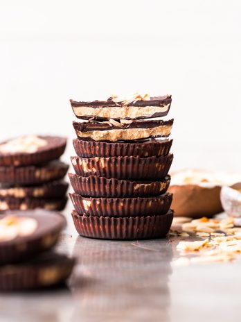 These Toasted Coconut Butter Cups are made with just four simple ingredients! Toasted coconut butter is the star of the show, encased in decadent homemade chocolate for a healthy homemade candy that will satisfy your sweet tooth. You're going to love these paleo + vegan coconut butter cups.