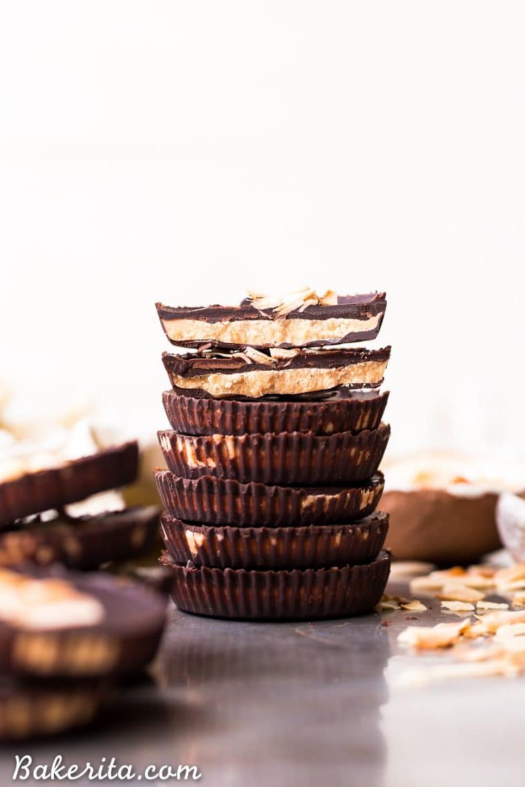 These Toasted Coconut Butter Cups are made with just four simple ingredients! Toasted coconut butter is the star of the show, encased in decadent homemade chocolate for a healthy homemade candy that will satisfy your sweet tooth. You're going to love these paleo + vegan coconut butter cups. #veganrecipes #paleo #chocolate #coconut #bakerita