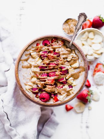 This Banana Date Smoothie Bowl (or smoothie) is a creamy and sweet treat that tastes like ice cream but is simple and healthy enough for breakfast thanks to a secret veggie that's snuck in there. Make yourself a bowl of this paleo and vegan banana date goodness on the next warm morning for a refreshing breakfast.