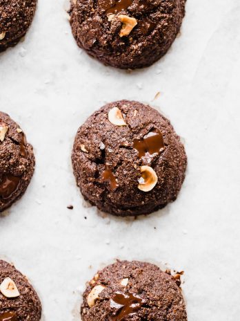 These Double Chocolate Hazelnut Cookies are soft, fudgy, and incredibly chocolatey! These irresistible cookies are loaded with melty dark chocolate chunks and crunchy hazelnuts, and you'd never guess they're gluten-free, paleo, and vegan.