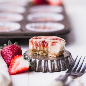 These No Bake Cashew Butter & Jelly Cheesecakes are sweet individual desserts that are lusciously creamy, simple to make, and swirled with strawberry jam. You can customize them with your favorite nut butter and jelly to make them your own! They're gluten-free, paleo and vegan.
