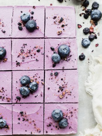 These creamy No-Bake Acai Maqui Berry Bars are full of antioxidants from acai + maqui berry powder - it's a punch of superfood power packed into a healthy and delicious dessert bar! These gluten-free, paleo and vegan bars are so refreshing - no baking necessary.