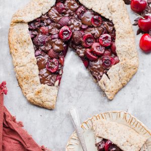 This Chocolate Cherry Galette is made with dark chocolate and fresh red cherries, all tucked into a super flaky pie crust that you would never guess is gluten-free, paleo and vegan. If you're a cherry fan, you need to try this chocolatey treat out ASAP!
