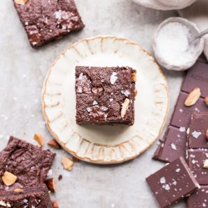 You'd never guess these super fudgy Salted Almond Brownies are gluten-free, paleo and vegan, because they taste just as good as a traditional brownie! They're incredibly fudgy and chocolatey and the toasted almonds and sea salt make them even better.