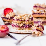 These Plum Crumble Bars have a delicious oatmeal crust and crumble topping that's filled with a simple plum jam. These simple bars highlight one of the summer's best stone fruits in a delicious gluten-free and vegan dessert.