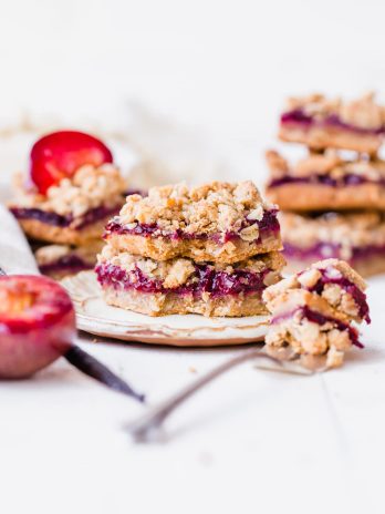 These Plum Crumble Bars have a delicious oatmeal crust and crumble topping that's filled with a simple plum jam. These simple bars highlight one of the summer's best stone fruits in a delicious gluten-free and vegan dessert.