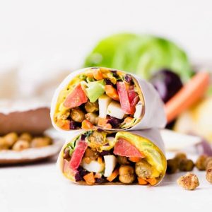 These Roasted Chickpea Veggie Wraps are a delicious gluten-free and vegan lunch or dinner that you can make ahead of time. They have a wonderful Turmeric Hummus spread inside and a Tahini Dressing/Dipping Sauce to serve with!