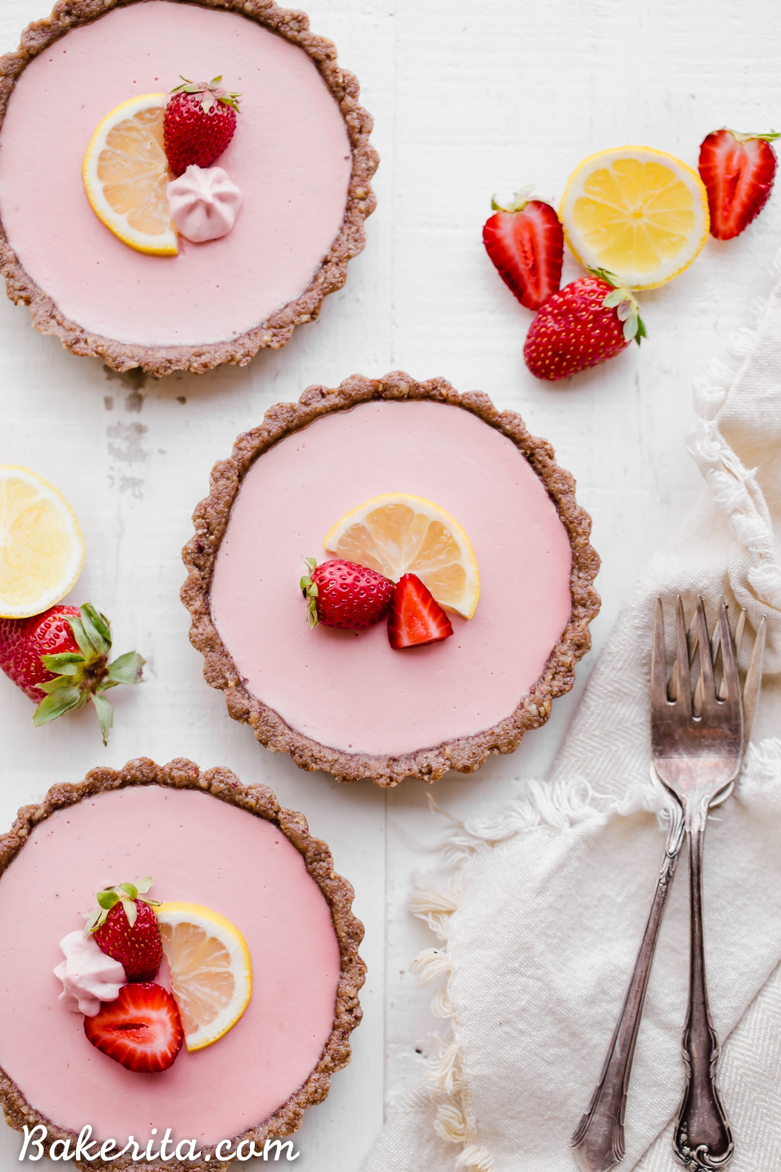 These No Bake Strawberry Lemonade Tarts have a raw "graham cracker" style crust filled with a super refreshing strawberry lemonade filling. These are SO good frozen on a hot day and they're gluten-free, paleo and vegan.