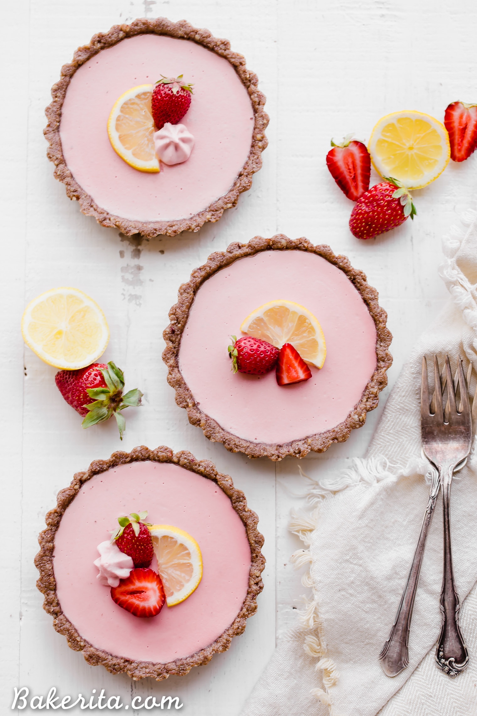 These No Bake Strawberry Lemonade Tarts have a raw "graham cracker" style crust filled with a super refreshing strawberry lemonade filling. These are SO good frozen on a hot day and they're gluten-free, paleo and vegan.