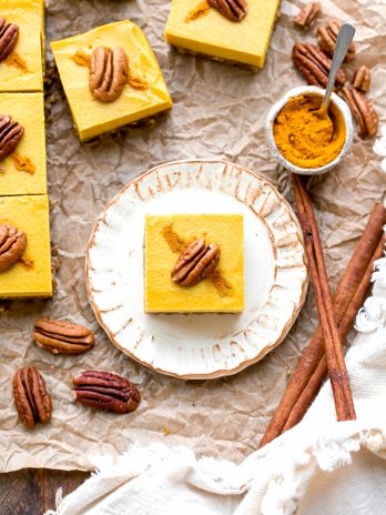 These No Bake Golden Milk Cheesecake Bars are a dessert that's loaded with the anti-inflammatory benefits of turmeric and the warmth and comfort of golden milk. They're deliciously spiced, gluten-free, paleo, vegan, and perfect for sharing.