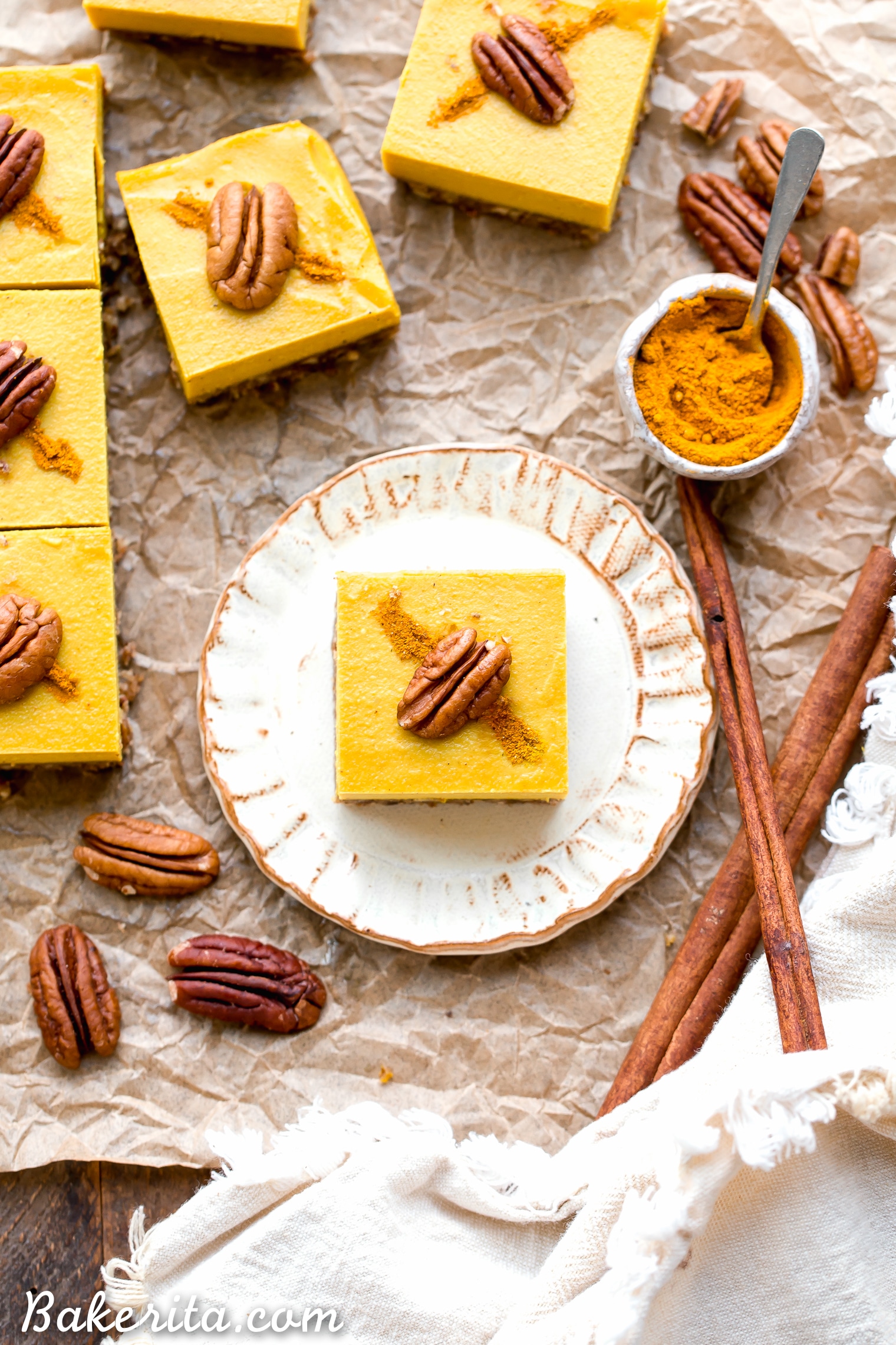 These No Bake Golden Milk Cheesecake Bars are a dessert that's loaded with the anti-inflammatory benefits of turmeric and the warmth and comfort of golden milk. They're deliciously spiced, gluten-free, paleo, vegan, and perfect for sharing.