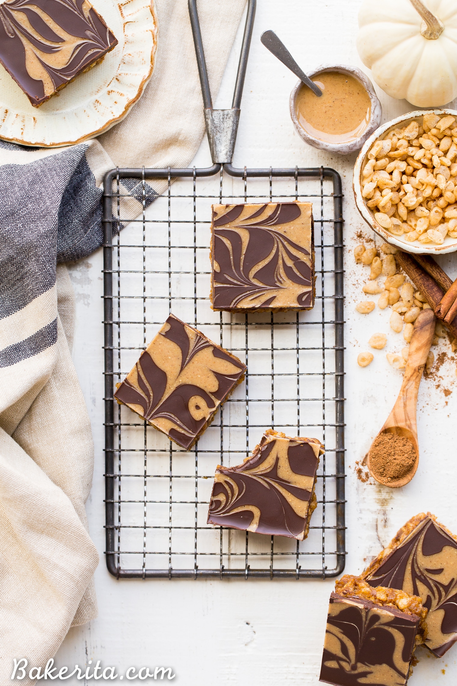 These Chocolate Pumpkin Spice Crispy Bars have a pumpkin spice rice crispy base, topped with a layer of dark chocolate and a pumpkin spice swirl. These bars are easy to make, beautiful, delicious, and gluten-free + vegan!