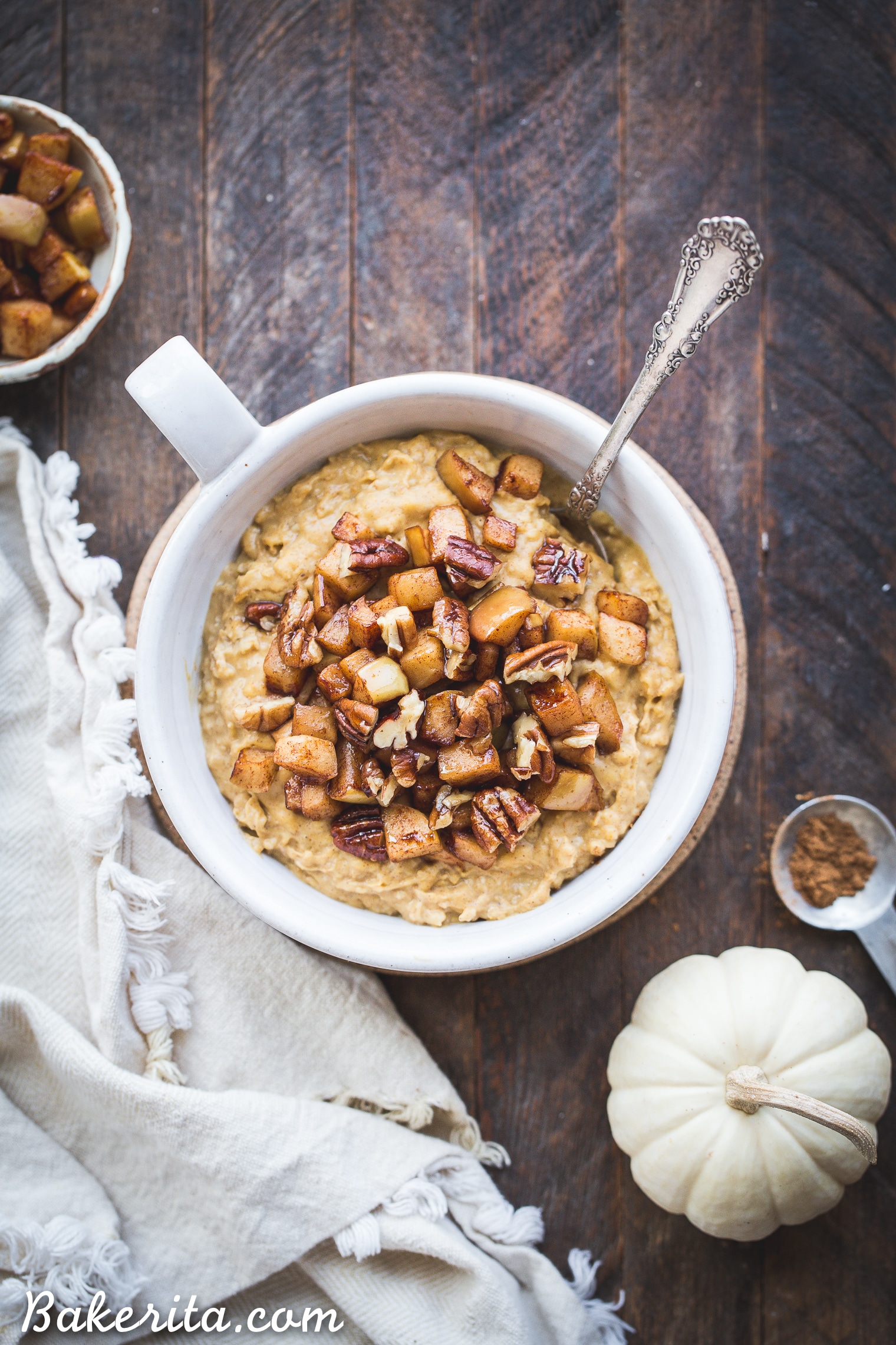 This Pumpkin Spice Oatmeal is rich, creamy, and perfect for chilly fall mornings. It's lightly sweetened with maple syrup and topped with warm sauteed apples. It's also gluten free and vegan. 