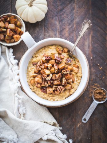 This Pumpkin Spice Oatmeal is rich, creamy, and perfect for chilly fall mornings. It's lightly sweetened with maple syrup and topped with warm sauteed apples. It's also gluten free and vegan. 