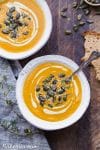 This Butternut Squash Soup is smooth, brightly flavored, and swirled with an easy cashew cream. It's topped off with crunchy spiced pumpkin seeds. This paleo and vegan soup is perfect for chilly days and best served with some crusty gluten-free bread!