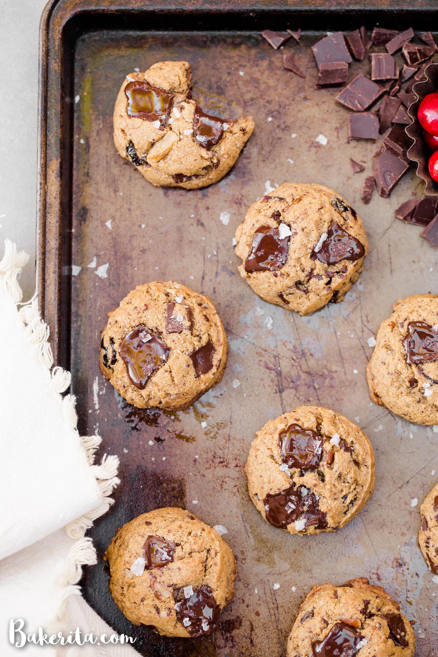 These Cranberry Pecan Chocolate Chip Cookies are gooey in the middle with perfectly crispy edges. Think: your favorite chocolate chip cookie, dressed up with dried cranberries and toasty pecans. I recommend devouring one of these gluten-free, paleo, and vegan cookies warm from the oven.