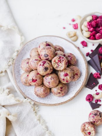 These Raspberry Dark Chocolate Energy Bites are deliciously filling and laced with the bold flavor of raspberries and shards of dark chocolate. They make the perfect gluten-free, paleo, and vegan snack or treat.