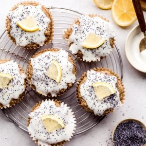 These Lemon Poppyseed Muffins are topped with a lemony glaze to bring out the tart, vibrant flavors of the tender, poppyseed-filled muffins! These gluten-free and vegan muffins are the perfect breakfast, snack, or lunchbox addition for spring.