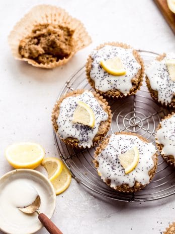 These Lemon Poppyseed Muffins are topped with a lemony glaze to bring out the tart, vibrant flavors of the tender, poppyseed-filled muffins! These gluten-free and vegan muffins are the perfect breakfast, snack, or lunchbox addition for spring.