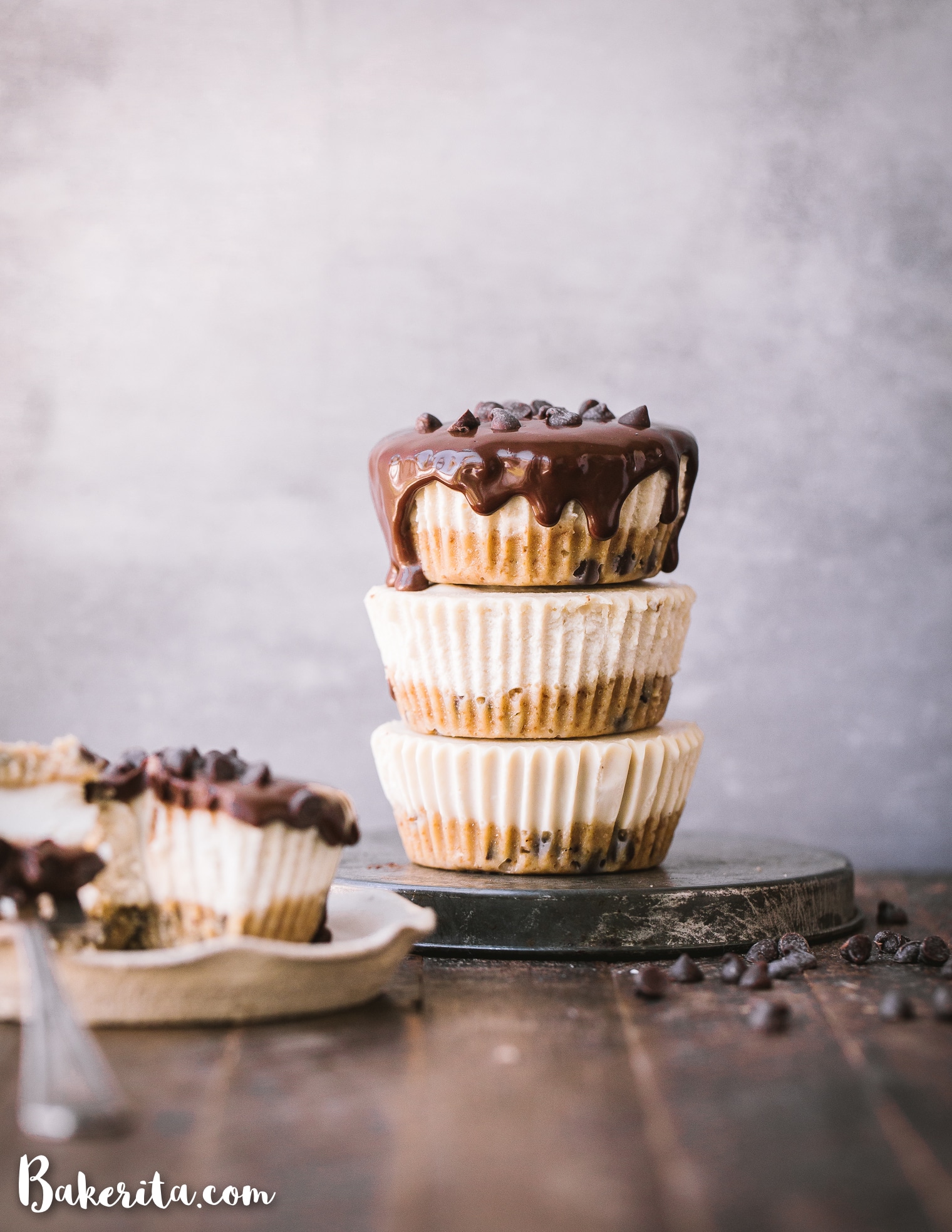 These No-Bake Vegan Chocolate Chip Cookie Dough Cheesecakes have a gluten-free and paleo cookie dough crust with a luscious cashew cheesecake filling. With dripping dark chocolate ganache on top, these make a decadent treat you'll make again and again!