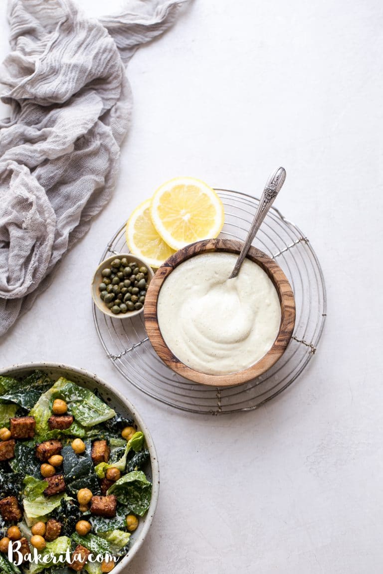 We make this creamy Vegan Caesar Dressing without any dairy, yet it maintains the creaminess you love from a classic Caesar dressing thanks to soaked cashews. The dressing is briny, salty, tart, and so delicious as a salad dressing, a dip, or spread on sandwiches and wraps.