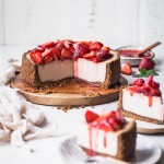 In this Baked Vegan Cheesecake, a gluten-free and paleo graham cracker-style crust encases a sweet and creamy vanilla cheesecake filling. Coconut yogurt and cashews create the perfect texture to mimic a classic cheesecake.