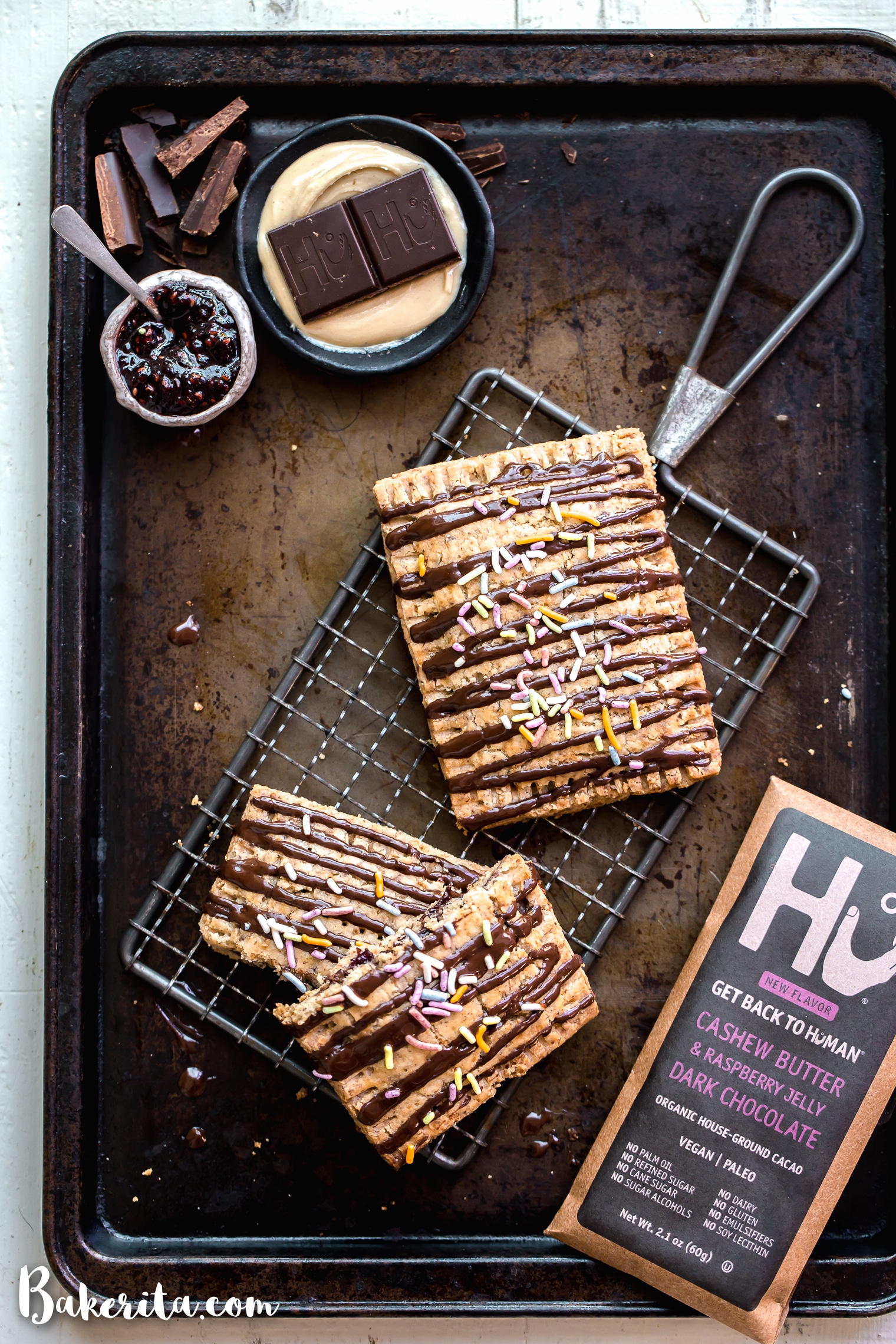 These Chocolate Cashew Butter & Jelly Pop Tarts are made with a flaky vegan and paleo crust and stuffed with cashew butter, raspberry jelly, and chopped Hu Kitchen chocolate. You’re going to go nuts for these paleo & vegan copycat of your favorite childhood treat!